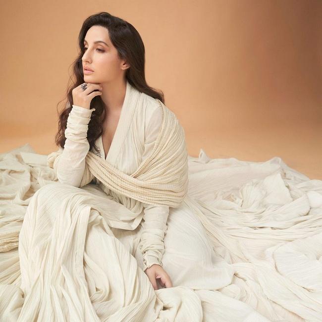 Actress Nora Fatehi Stunning Looks in White Dress