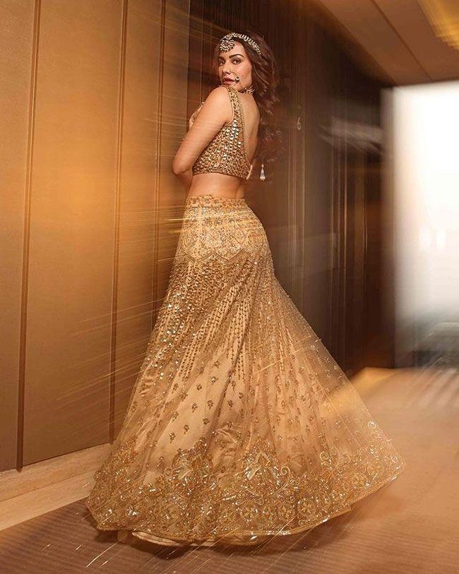 Angelic Looks Of Amyra Dastur In Golden Dress