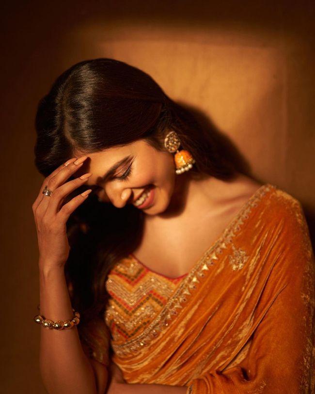 Malavika Mohanan Looking Delightful In Dazzling Yellow Saree