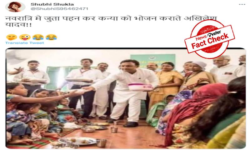 FACT CHECK: Old image of Akhilesh Yadav wearing footwear while serving food  shared as recent