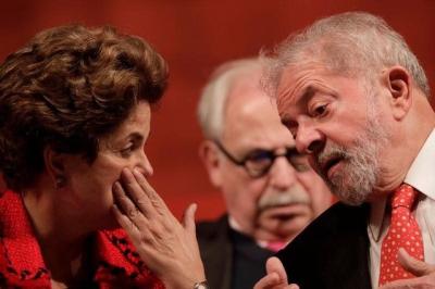 Former Brazilian President Luiz Inacio Lula da Silva speaks with former Brazilian President Dilma Rousseff during the inauguration of the new National Directory of the Workers' Party, in Brasilia, Brazil July 5, 2017. REUTERS/Ueslei Marcelino