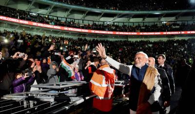 Prime Minister Narendra Modi waves as he leaves  Wembley Stadium in London after addressing the Indian community  on Friday night. Credit: PTI Photo by Vijay Verma