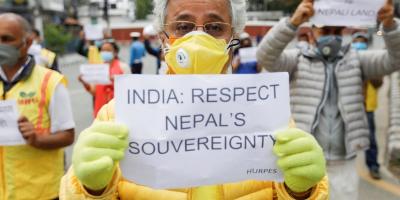 Activists affiliated with 'Human Rights and Peace Society Nepal' holding placards protest against the alleged encroachment of Nepal's border by India in the far west of Nepal, near the Indian Embassy in Kathmandu, Nepal May 12, 2020. Photo: Reuters/Navesh Chitrakar/File Photo