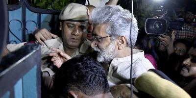 Writer and activist Gautam Navlakha being taken in to custody by the Pune police on August 28, 2018. Photo: PTI