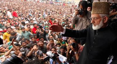 In this photo from 2008, Syed Ali Shah Geelani waves at a crowd in Srinagar. Photo: PTI