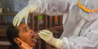 A health worker conducts a COVID-19 test in Kolkata. Photo: PTI