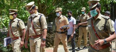 Thoothukudi SP Arun Balagopalan (2nd L), Additional Superintendent of Police D Kumar (L), DSP C Prathapan (R) and police constable Maharajan (4th L, not in uniform) leave after appearing before the Madurai Bench of Madras high court for Sathankulam custodial deaths, in Madurai, Tuesday, June 30, 2020. Photo: PTI