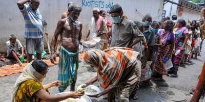 Volunteers distribute food among the needy in Kolkata. Photo: PTI