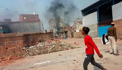 Representative image. Smoke rises after a shop was set on fire during riots at Karawal Nagar area of East Delhi, February 25, 2020. Photo: PTI