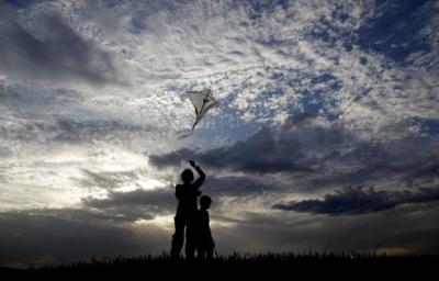Children fly a kite in Islamabad. Photo: Reuters/Caren Firouz