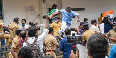 Police personnel try to control Congress party workers during a protest against Swapna Suresh and Sandeep Nair, accused in Kerala gold smuggling case, in Kochi, Sunday, July 12, 2020. Photo: PTI 