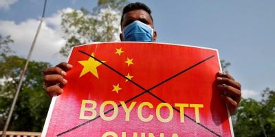 A member of National Students' Union of India holds a placard during a protest against China, in Ahmedabad on June 18, 2020. File Photo:Reuters/Amit Dave