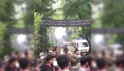A screengrab from a video reportedly showing police teargassing a Muharram procession at Budgam. Photo: Twitter/@pzfahad
