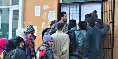 People queue up to go online at a government set-up internet cafe in Budgam, Indian-administered Kashmir on December 24, 2019. Photo: Thomson Reuters Foundation/Athar Parvaiz