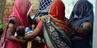Family members and relatives mourn the death of a 19-year-old woman, who was gang-raped two weeks ago, in Hathras district, Tuesday, Sept. 29, 2020. The Dalit teen died at a hospital in Delhi on Tuesday morning. Photo: PTI