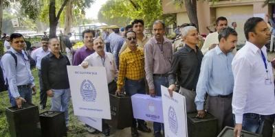 Election officials make preparations for polling at the BDC elections being held across 22 districts of Jammu and Kashmir. Photo: PTI/File