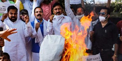 Activists of Jammu and Kashmir National Panthers Party (JKNPP) burn an effigy during a protest against the central government, in Jammu, Wednesday, October 28, 2020. Photo: PTI