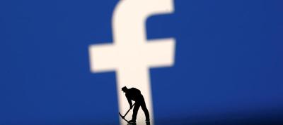 A figurine is seen in front of the Facebook logo in this illustration taken March 20, 2018. Photo: Reuters