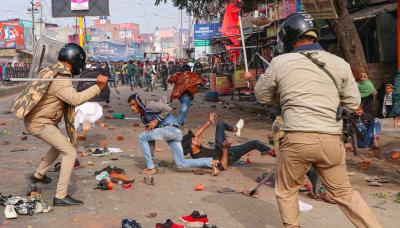 Police beat up anti-CAA protestors in Lucknow. Photo: PTI