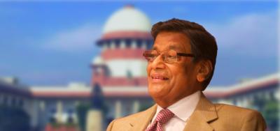 Attorney General K.K. Venugopal against the blurred background of the Supreme Court of India. Foreground photo: Nikhil Kanekal, CC BY-SA 3.0