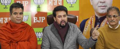 J&K DDC election in-charge Anurag Thakur along with BJP J&K state president Ravinder Raina and others address a press conference at the party office on December 23, 2020. Photo: PTI
