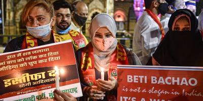 Representational image of activists holding placards and light candles demanding justice for rape victims and to prevent crimes against women. Photo: PTI/Mitesh Bhuvad