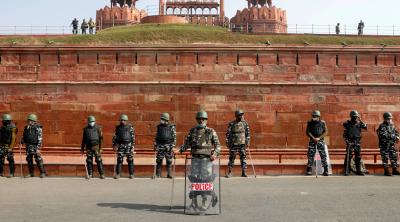 Policemen stand guard in front of the historic Red Fort after clashes between police and farmers, in the old quarters of Delhi, India, January 27, 2021. Photo: Reuters/Adnan Abidi
