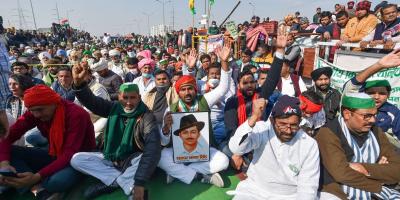 Farmers raise slogans at Ghazipur border as they observe a hunger strike on Mahatma Gandhi's death anniversary. Photo: PTI