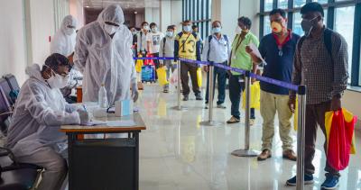 Passengers go through screening before boarding a special flight to Chennai from Mohanbari Airport, during the ongoing nationwide COVID-19 lockdown, in Dibrugarh, Saturday, May 23, 2020. Photo: PTI