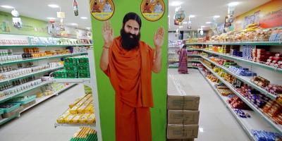 A hoarding with an image of Baba Ramdev is seen inside a Patanjali store in Ahmedabad. Photo: Reuters/Amit Dave