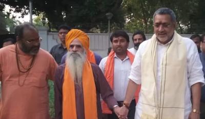 File photo of Yati Narasinghnand Saraswati (left), along with Giriraj Singh, minister for animal husbandry in the Modi government. Between them is B.L. Sharma, a former BJP MP. The man in the white shirt and saffron scarf behind them is Deepak Singh Hindu, a close associate of Yati and founder of the 'Hindu Force', who called on people to assemble at Maujur chowk on February 23, 2020, the day the Delhi riots began.  