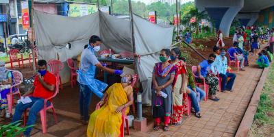 A medic collects a sample from a woman for COVID-19 test, in Thane, Thursday, April 8, 2021. Photo: PTI