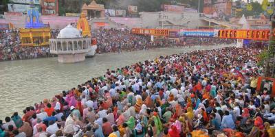 Devotees gather at Har Ki Pauri Ghat to offer prayers during Kumbh Mela 2021, in Haridwar, Sunday, April 11, 2021. Photo: PTI