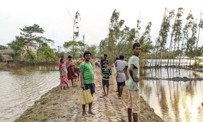 Villagers in Sunderbans' Gangapur village came to inspect their inundated houses. Photo: Himadri Ghosh
