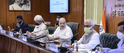 Union Home Minister Amit Shah (C), Jammu and Kashmir Lt. Gov. Manoj Sinha (2L) and other officials during a meeting to review developmental activities in J&K, in New Delhi, Friday, June 18, 2021. Photo: PTI/Kamal Kishore