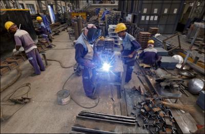 File image of workers at an ordnance factory. Photo: Reuters