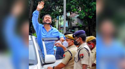Akhil Gogoi waves from outside the NIA court in Guwahati on Thursday, July 1. Photo: PTI