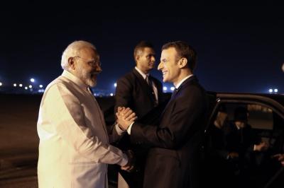 Modi greets French President Emmanuel Macron as he arrives in India. Credit: Emmanuel Macron/Twitter