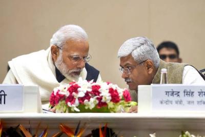 Prime Minister Narendra Modi with Jal Shakti Minister Gajendra Singh Shekhawat during the launch of the Atal Bhujal Yojana, a mission to help in supplying water to every household by 2024, in New Delhi.
Photo: PTI/Shahbaz Khan