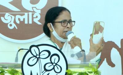 Mamata Banerjee holds up her taped phone in an earlier press conference. Photo: YouTube screengrab