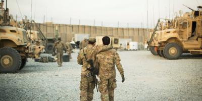 FILE PHOTO: A U.S. soldier from the 3rd Cavalry Regiment walks with the unit's Afghan interpreter before a mission near forward operating base Gamberi in the Laghman province of Afghanistan December 11, 2014. Photo: Reuters/Lucas Jackson/File Photo
