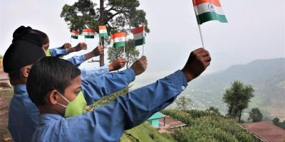 School children of Baba Garib Das Academy who are coming for community classes celebrate Azadi Ka Amrit Mahotsav commemorating 75th Independence Day at Krishna Ghati Sector in Poonch district, Thursday, Aug 12, 2021.  Photo: PTI