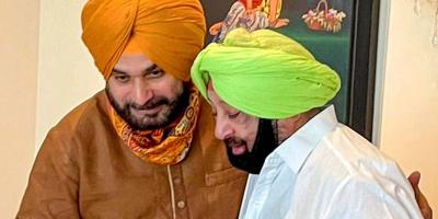 Punjab CM Captain Amarinder Singh with State Congress chief Navjot Singh Sidhu during a meeting in Chandigarh, Friday, Aug 20, 2021. Photo: PTI