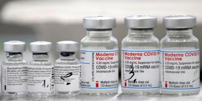 Vials of coronavirus disease (COVID-19) vaccines of Pfizer-BioNTech and Moderna are seen in the town of Ricany near Prague, Czech Republic, February 25, 2021. Photo: Reuters/David W. Cerny/File Photo