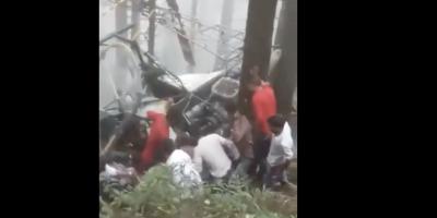People gathered around the crashed helicopter. Photo: Screengrab from video