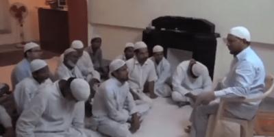 Screenshot of video in which a senior IAS officer from Uttar Pradesh, Mohammed Iftikharuddin, is seen sitting with a group of men listening to a religious preacher. Photo: Twitter