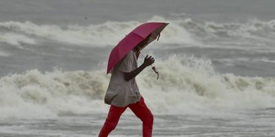 Representative: A man walks along the shore before the landfall of Cyclone Nivar at Marina Beach in Chennai, Tuesday, November 24. Photo: R Senthil Kumar/PTI.