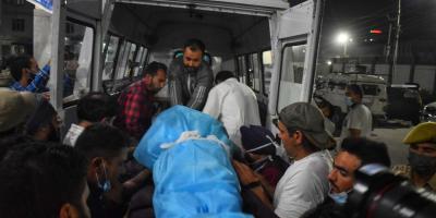 Makhan Lal Bindroo's body being transported after the attack. Photo: Faizan Mir 