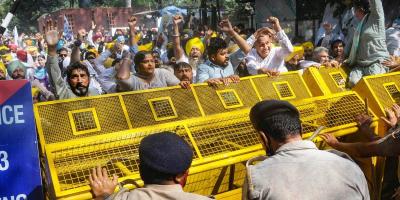 Police stop Aam Aadmi Party supporters who were staging a protest over Lakhimpur Kheri violence, outside the Raj Bhawan in Chandigarh, Wednesday, Oct 6, 2021. Photo: PTI
