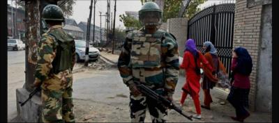 Members of the Army stand guard outside a school in Kashmir. Photo: PTI
